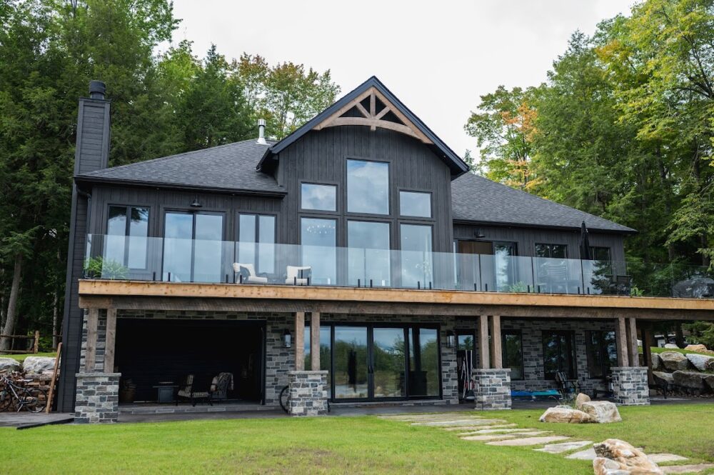 Black home with glass InvisiRail railings.